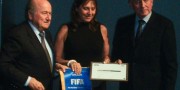 Laura Macchiotti receives  FIFA/CIES award from Joseph Blatter and Bertrand Reeb