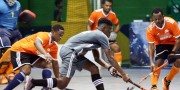 Shakeem Fausette (on the ball) in action for Saints Hockey Club against GCC