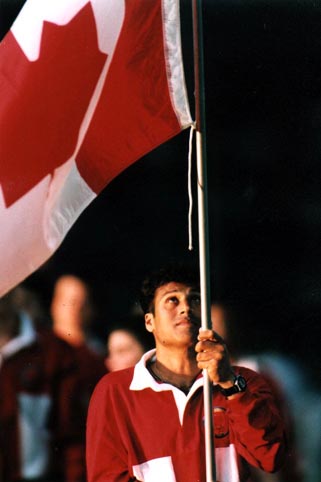 Paul "Bubli" Chohan carries the flag of the Canadian team during the Opening Ceremony of the 1995 Pan American Games in Mar del Plata