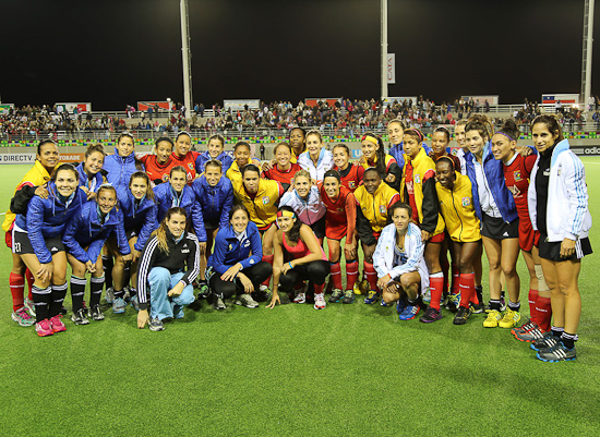 Guyana players pose with Argentina after their match at the 2013 Pan American Cup in Mendoza